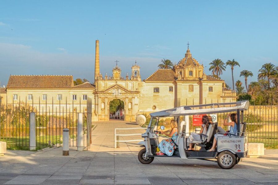 Seville: Private City Tour by Eco Tuk Tuk - Puente de Isabel II and the Triana connection