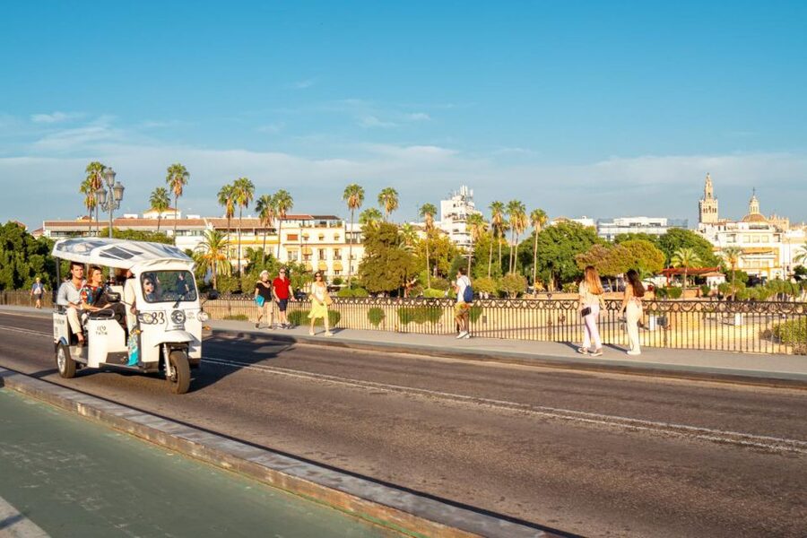 Seville: Private City Tour by Eco Tuk Tuk - The Guadalquivir River and Paseo de Cristóbal Colón