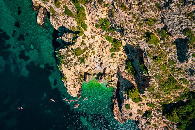Uncharted Marine Reserve Cave, Snorkel & Cliff Jumping Kayak Tour - Cala Tango and the choice of cliff jumps