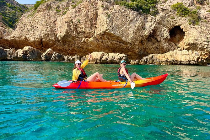 Uncharted Marine Reserve Cave, Snorkel & Cliff Jumping Kayak Tour - Getting back into the kayak