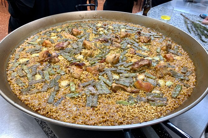 Valencian paella cooking class, tapas and visit to Ruzafa market. - Making sangria before the paella